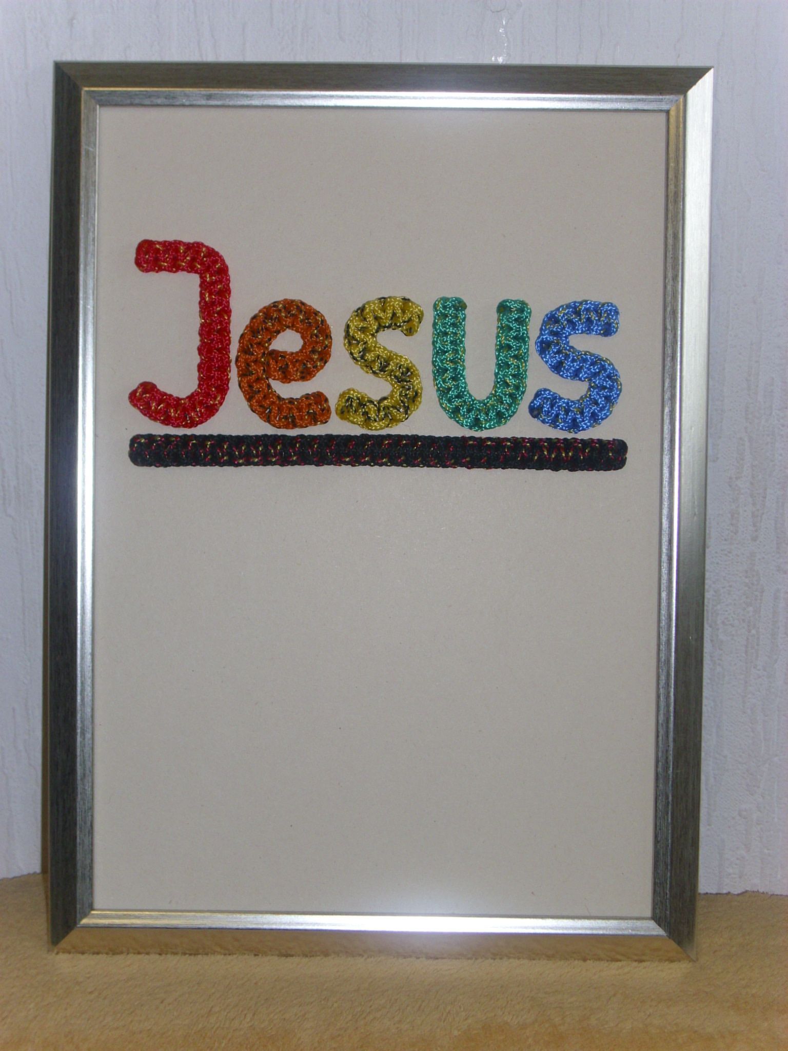JESUS in Regenbogenfarben geknotet, mit Rahmen, ca. 32 x 24 cm, Best.Nr. 032, 35,- Euro